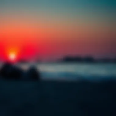 A sunset over Al Qurm Beach, highlighting the beautiful colors reflecting on the water.