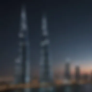 Night view of Dubai towers illuminated against the dark sky