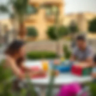 Community Life in Nad El Sheba Gardens Families enjoying community amenities in Nad El Sheba Gardens
