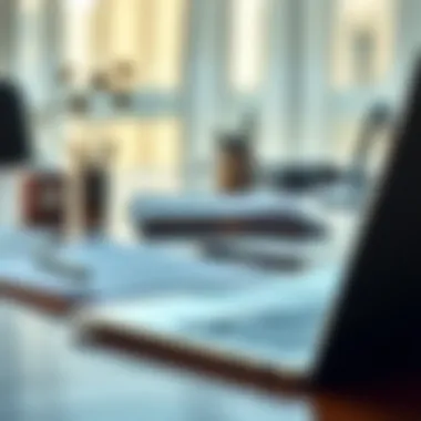 A close-up of a business desk with documents and a laptop reflecting freelance work