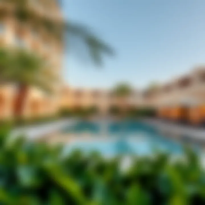 Luxurious swimming pool area surrounded by lush greenery at The Centre Residence